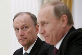 FILE PHOTO: Russian Security Council Secretary Nikolai Patrushev (L) looks at President Vladimir Putin during a meeting with the BRICS countries' senior officials in charge of security matters at the Kremlin in Moscow