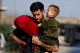 Palestinians fleeing north Gaza move southward, as Israeli tanks roll deeper into the enclave, amid the ongoing conflict between Israel and Hamas, in the central Gaza Strip