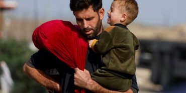 Palestinians fleeing north Gaza move southward, as Israeli tanks roll deeper into the enclave, amid the ongoing conflict between Israel and Hamas, in the central Gaza Strip