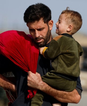 Palestinians fleeing north Gaza move southward, as Israeli tanks roll deeper into the enclave, amid the ongoing conflict between Israel and Hamas, in the central Gaza Strip