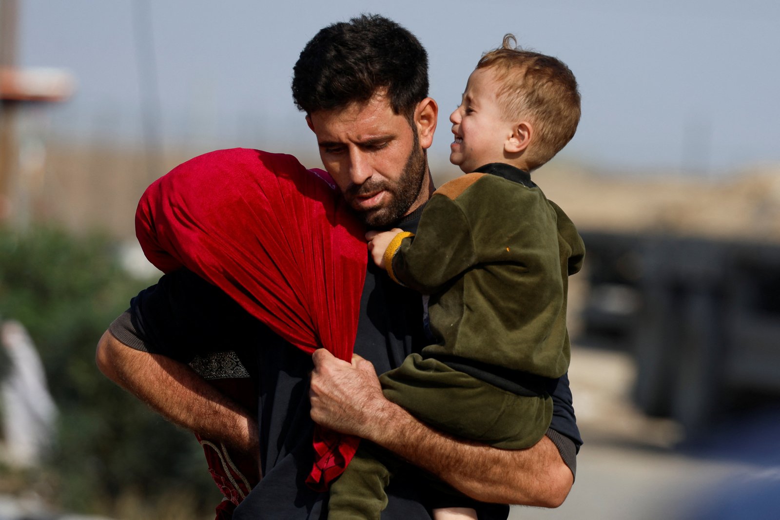 Palestinians fleeing north Gaza move southward, as Israeli tanks roll deeper into the enclave, amid the ongoing conflict between Israel and Hamas, in the central Gaza Strip