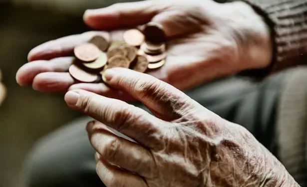 1_Senior-womans-hands-with-coinsjpeg